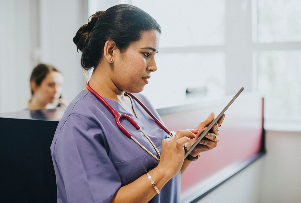 Image of a nurse preparing a hipaa-compliant form with e-signature