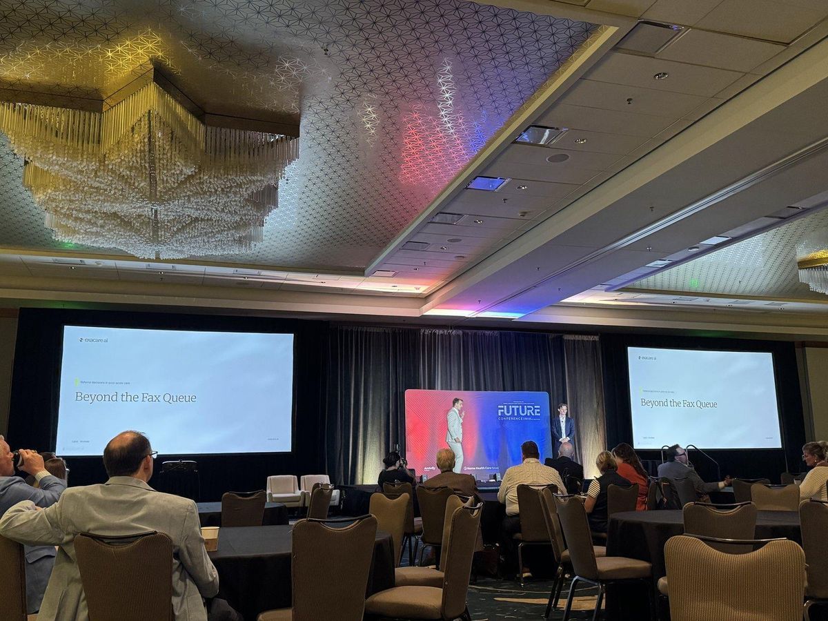 Exacare ai presenting the main-stage session Beyond the Fax Queue to a seated audience at the FUTURE Conference 2026